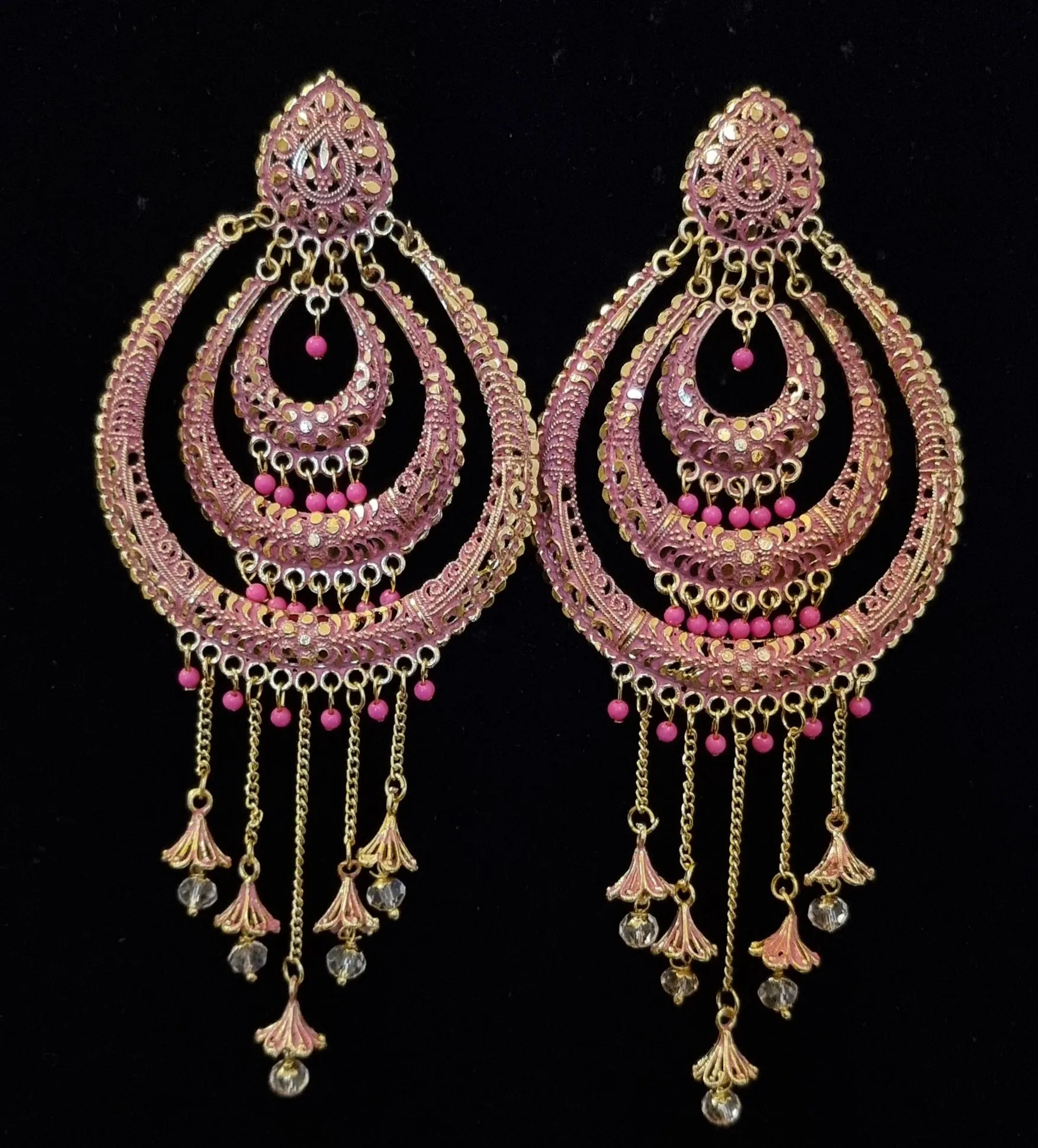 Long jhumka style earrings with tassels.